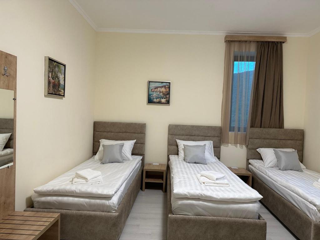 Postel nebo postele na pokoji v ubytování Hotel X