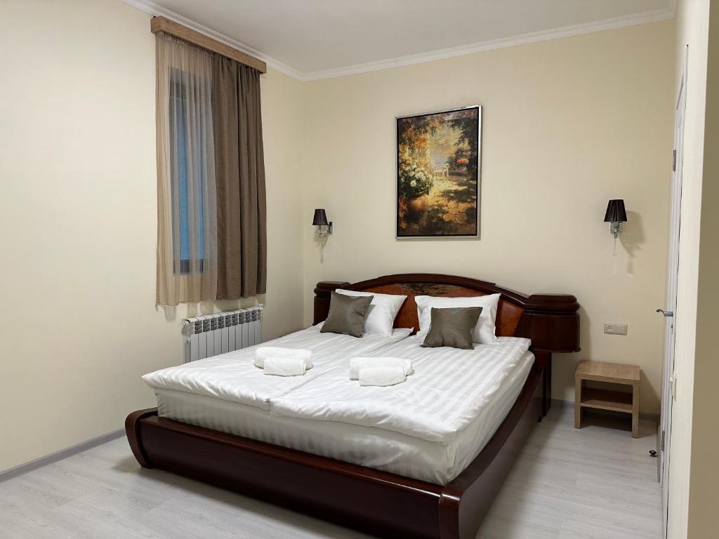 Postel nebo postele na pokoji v ubytování Hotel X
