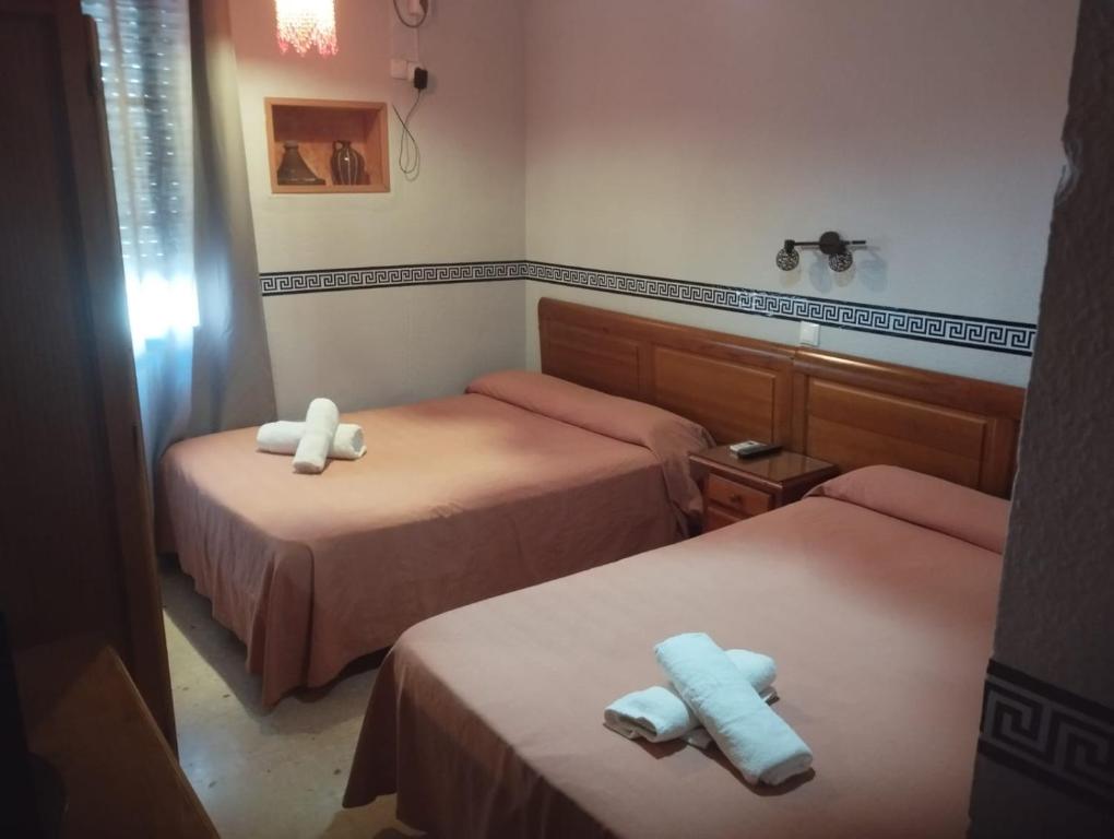 Posteľ alebo postele v izbe v ubytovaní Hospedería Lucano
