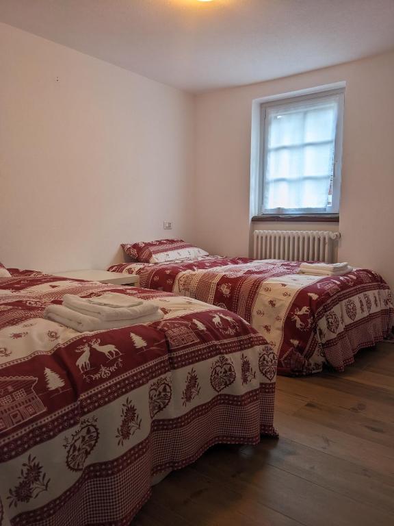 Postel nebo postele na pokoji v ubytování Casa della Frua - Frudarhus
