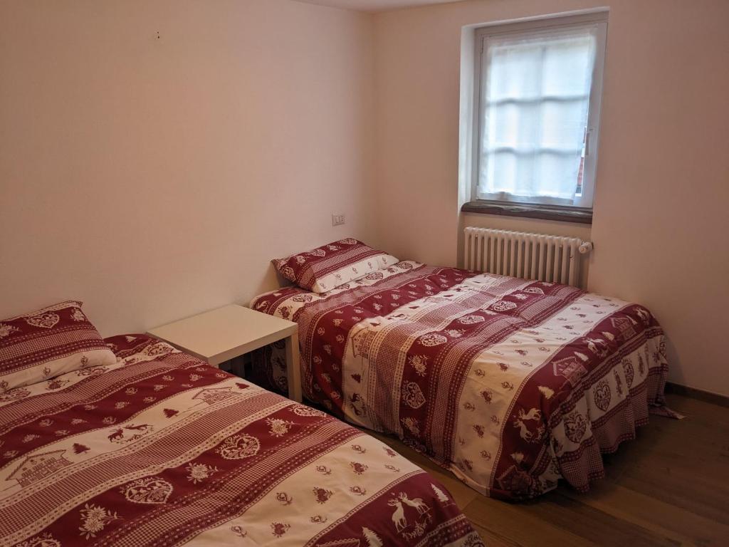 Postel nebo postele na pokoji v ubytování Casa della Frua - Frudarhus