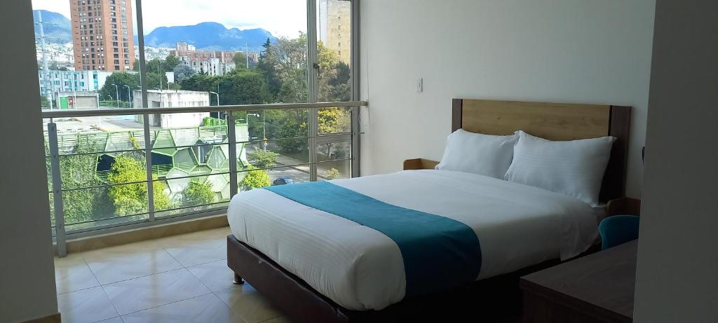 Postel nebo postele na pokoji v ubytování Hotel Royal Cid Bogota
