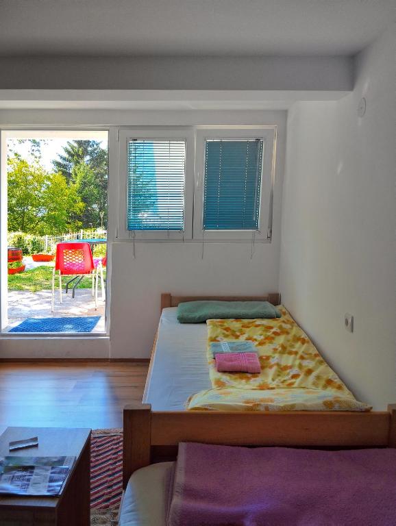 Postel nebo postele na pokoji v ubytování Guesthouse Mirkovic