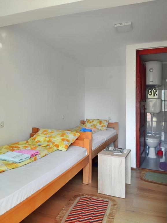 Postel nebo postele na pokoji v ubytování Guesthouse Mirkovic
