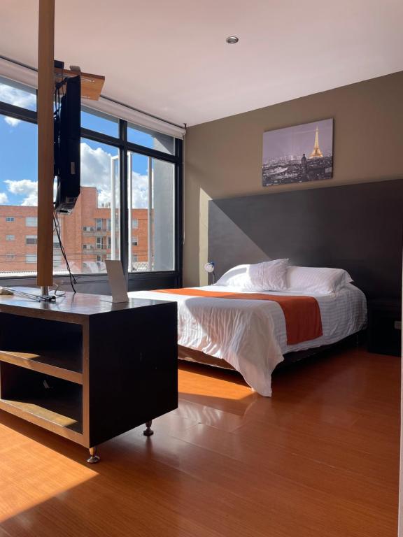 Postel nebo postele na pokoji v ubytování Hotel Juliette Bogota