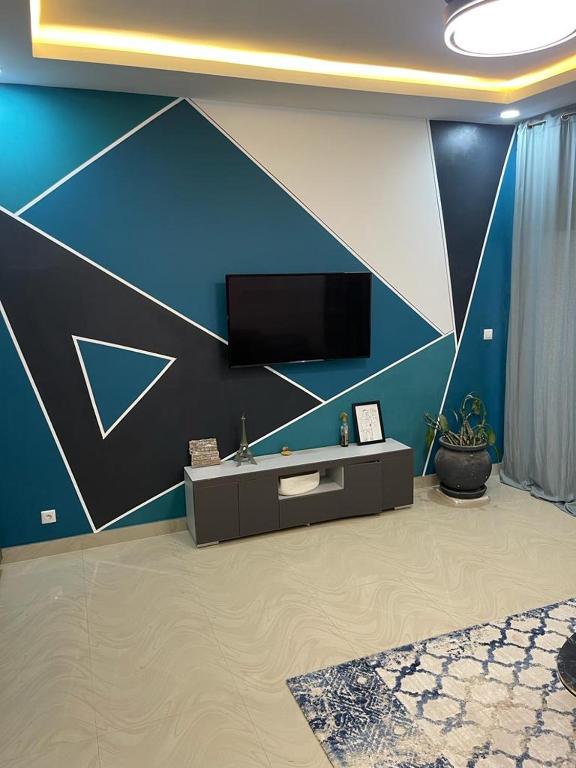TV a/nebo společenská místnost v ubytování Appartement 1 chambre, Salon ABA