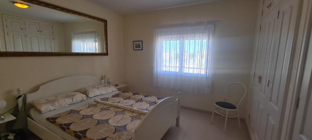 Postel nebo postele na pokoji v ubytování Callao Sun & Pool II