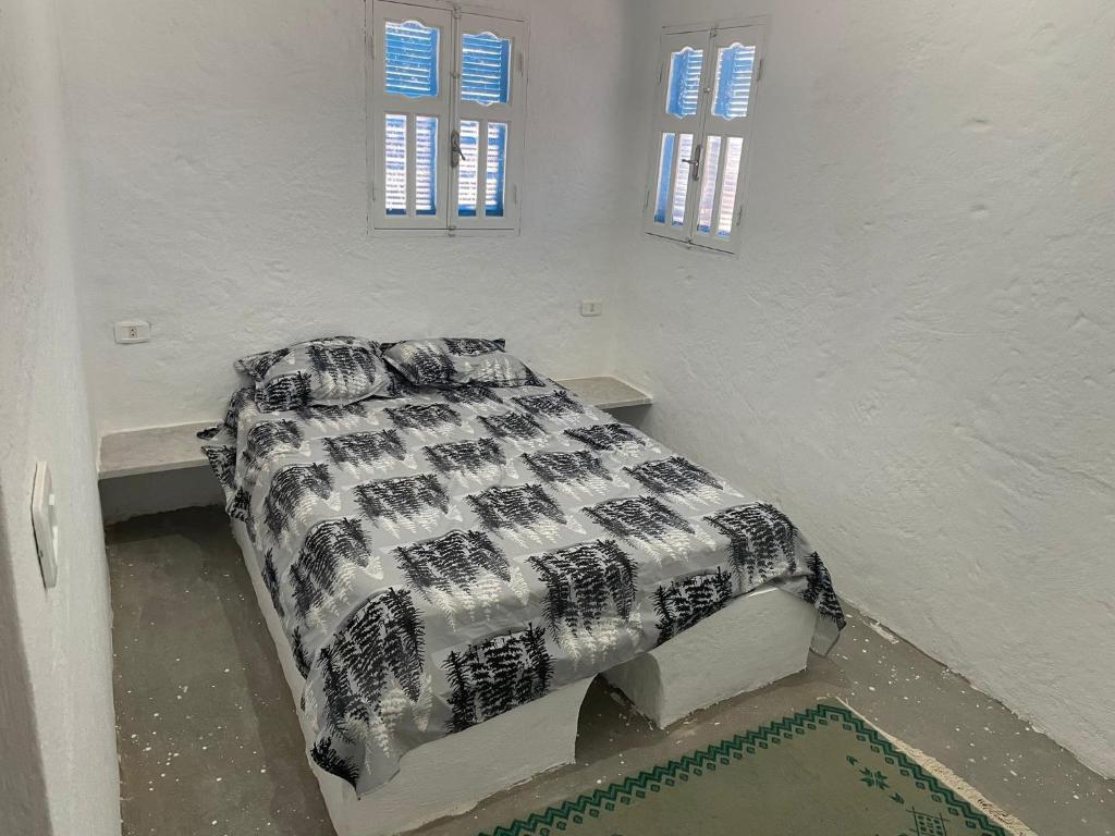 Кровать или кровати в номере Dar El Amel