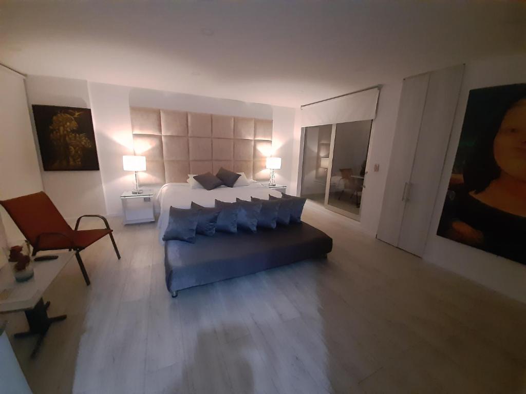 Postel nebo postele na pokoji v ubytování Mirador samsara Suite Luxury piso completo