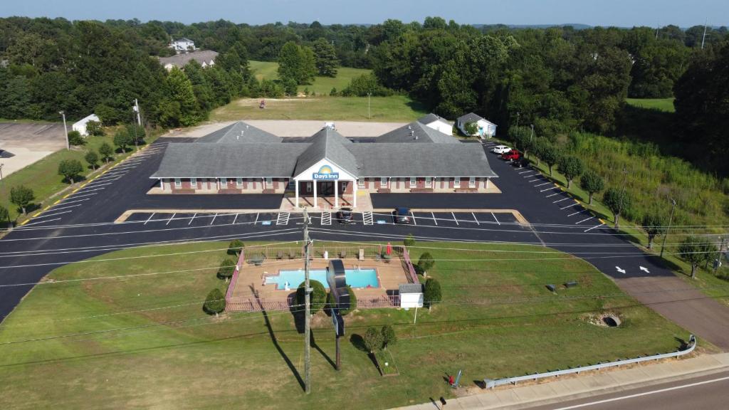 an aerial view of a house with a large yard at Days Inn by Wyndham Savannah in Savannah