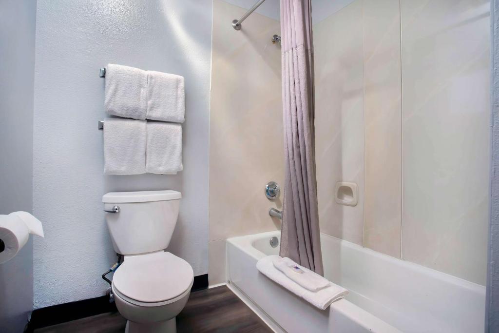 a white bathroom with a toilet and a shower at Motel 6-Bend, OR in Bend