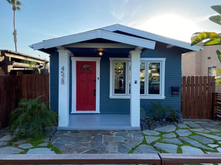 a small blue house with a red door at Craftsman Bungalow- University Heights 2BR Home in San Diego