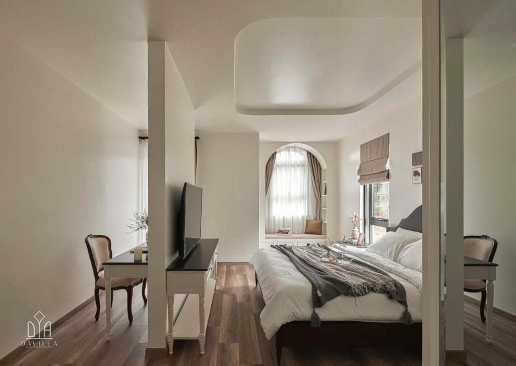 Postel nebo postele na pokoji v ubytování Davilla Đà Lạt Villa Collection