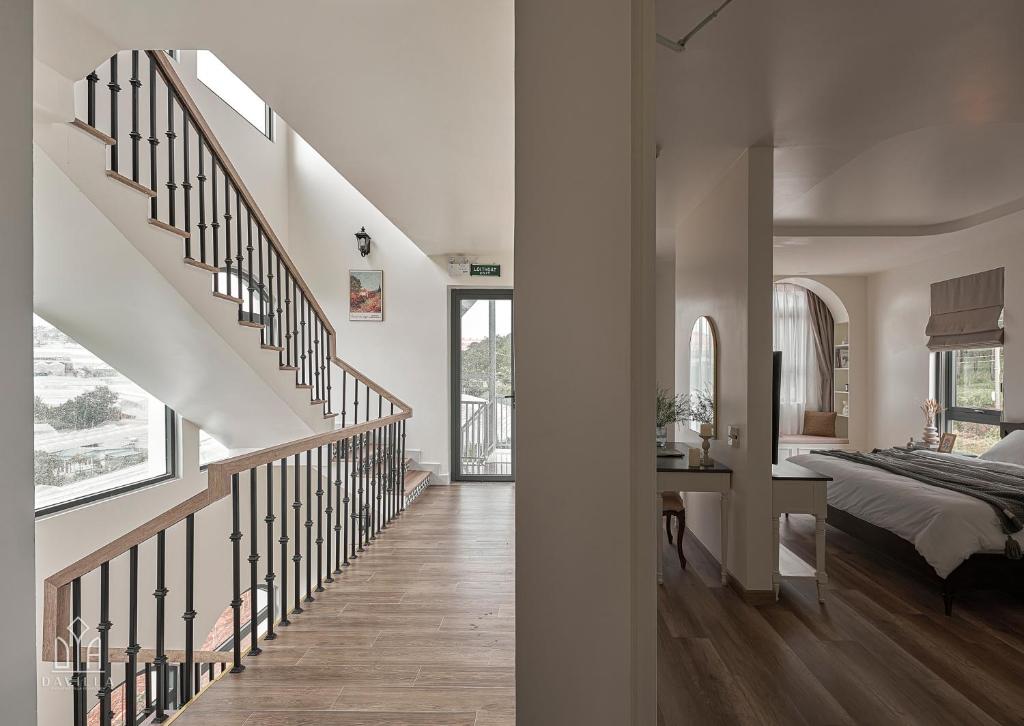 Postel nebo postele na pokoji v ubytování Davilla Đà Lạt Villa Collection