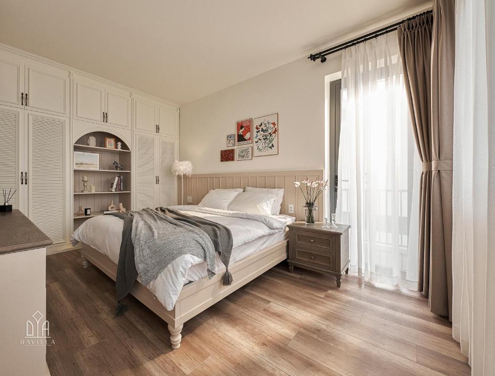 Postel nebo postele na pokoji v ubytování Davilla Đà Lạt Villa Collection
