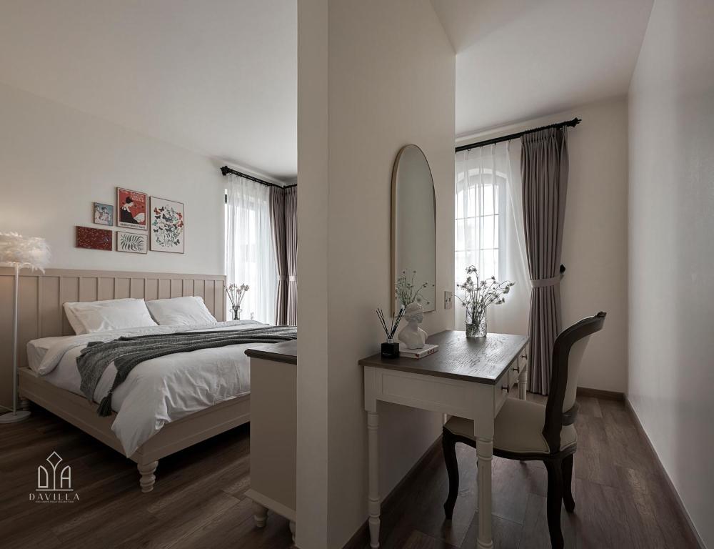 Postel nebo postele na pokoji v ubytování Davilla Đà Lạt Villa Collection
