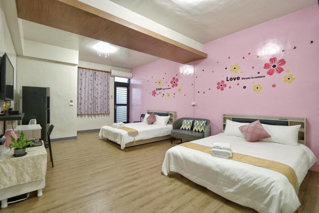 Postel nebo postele na pokoji v ubytování Wanghong Homestay