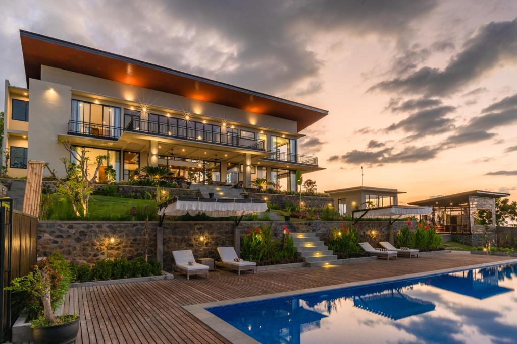 an image of a house with a swimming pool at Villa Lovina Hill Paradise in Buleleng