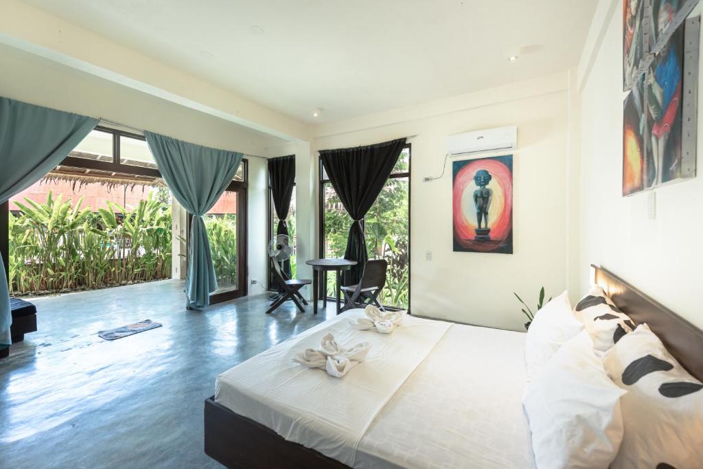 Postel nebo postele na pokoji v ubytování Ohana Resort Siargao
