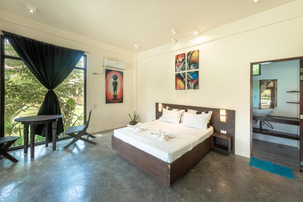 Postel nebo postele na pokoji v ubytování Ohana Resort Siargao