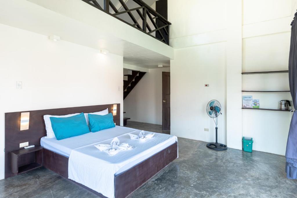 Postel nebo postele na pokoji v ubytování Ohana Resort Siargao