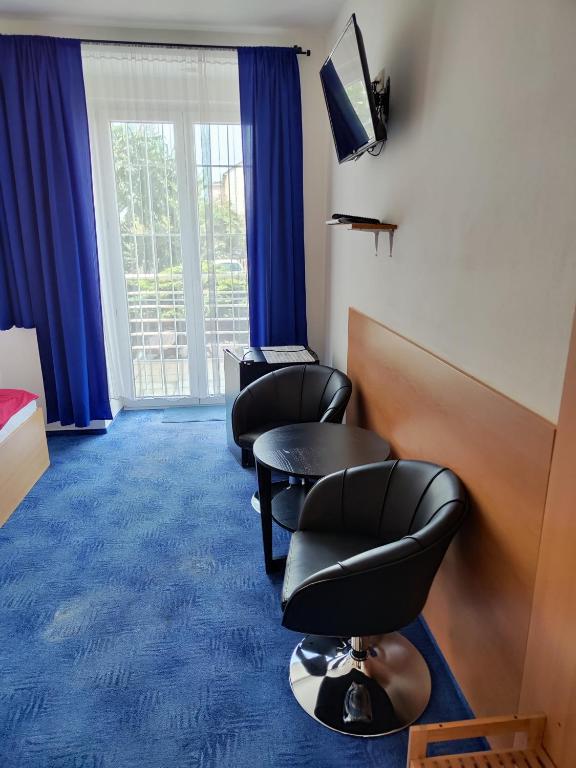 TV a/nebo společenská místnost v ubytování Hotel O.K. 1