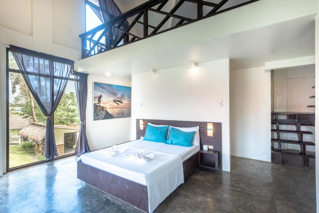 Postel nebo postele na pokoji v ubytování Ohana Resort Siargao