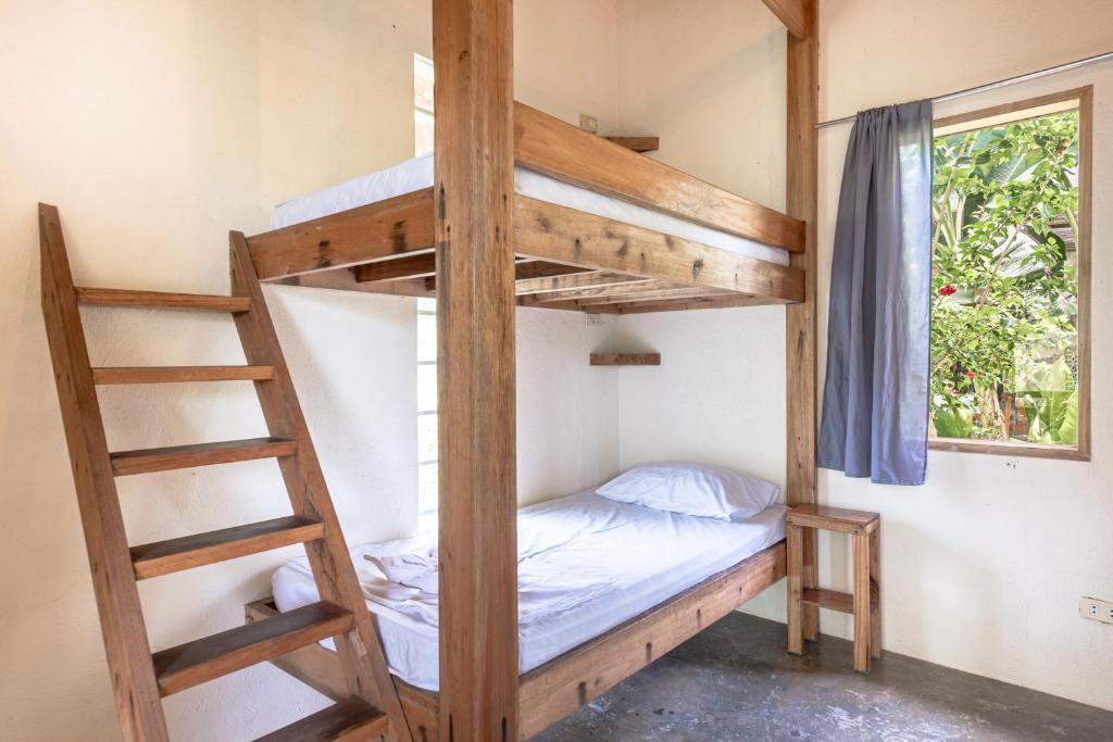 Postel nebo postele na pokoji v ubytování Ohana Resort Siargao