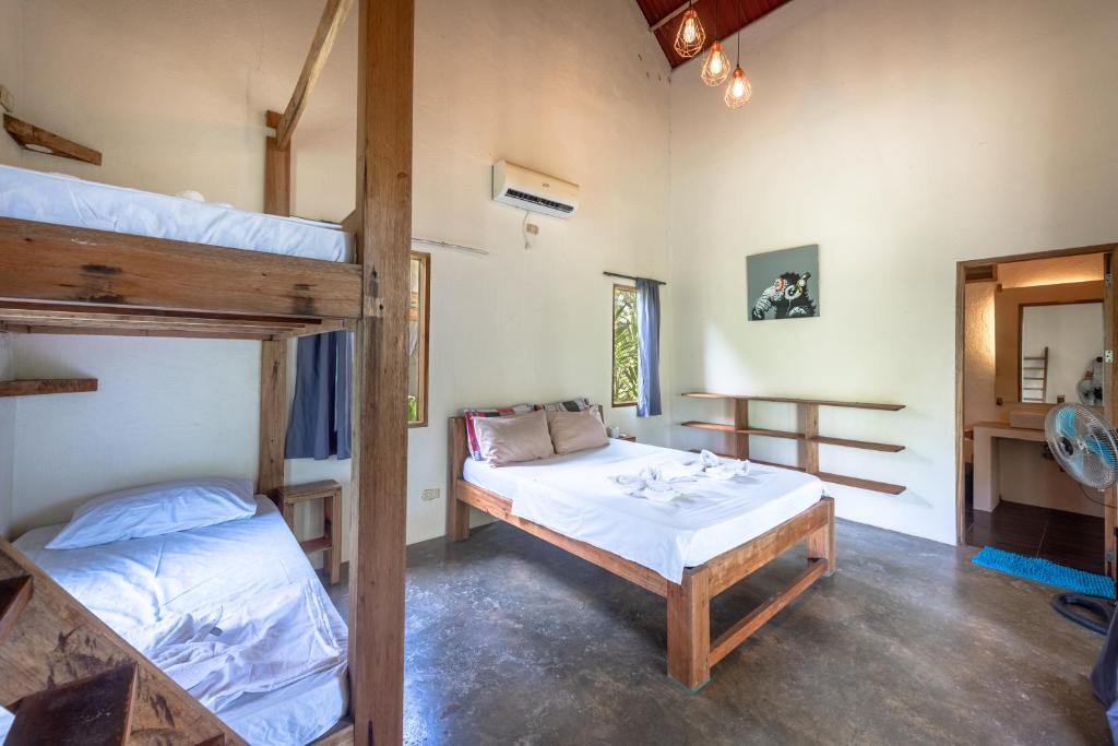 Postel nebo postele na pokoji v ubytování Ohana Resort Siargao