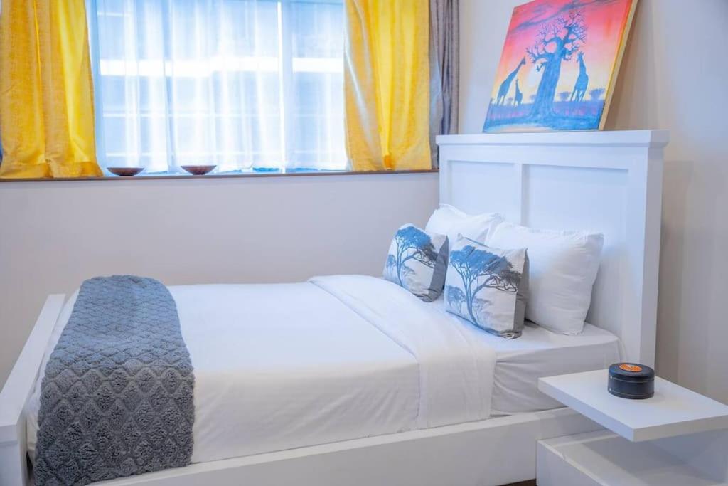 Postel nebo postele na pokoji v ubytování Skynest Residences Nairobi, Westlands