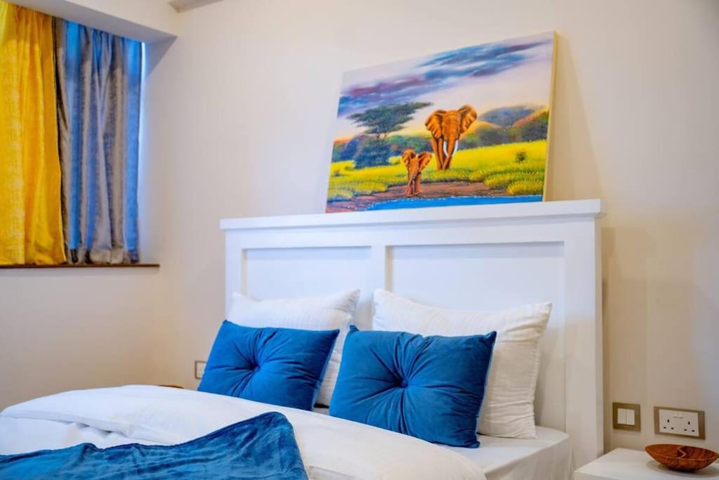 Postel nebo postele na pokoji v ubytování Skynest Residences Nairobi, Westlands