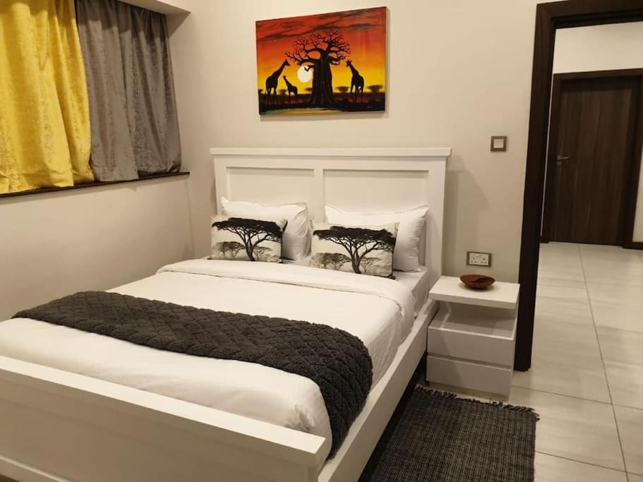 Postel nebo postele na pokoji v ubytování Skynest Residences Nairobi, Westlands