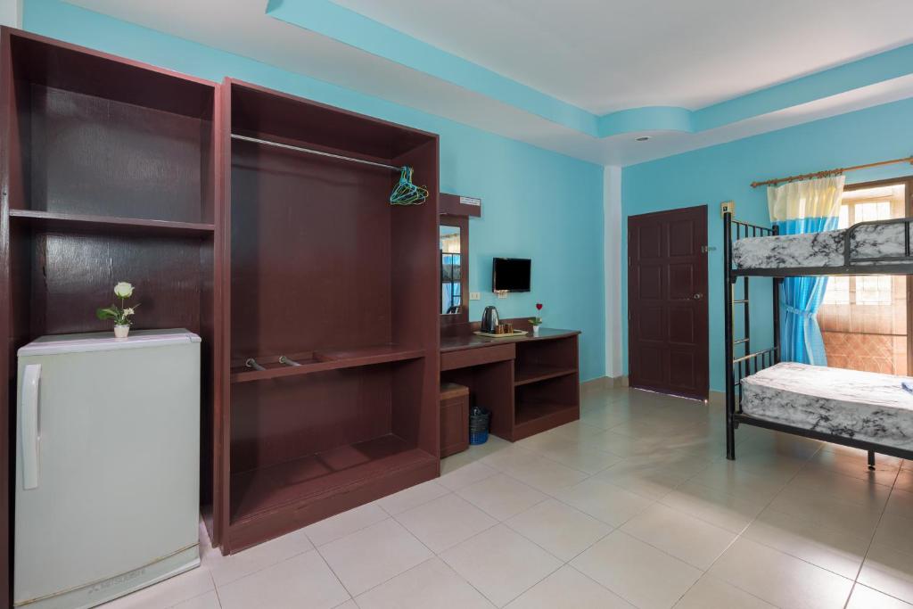 a room with two bunk beds and a desk at Grand View in Patong Beach