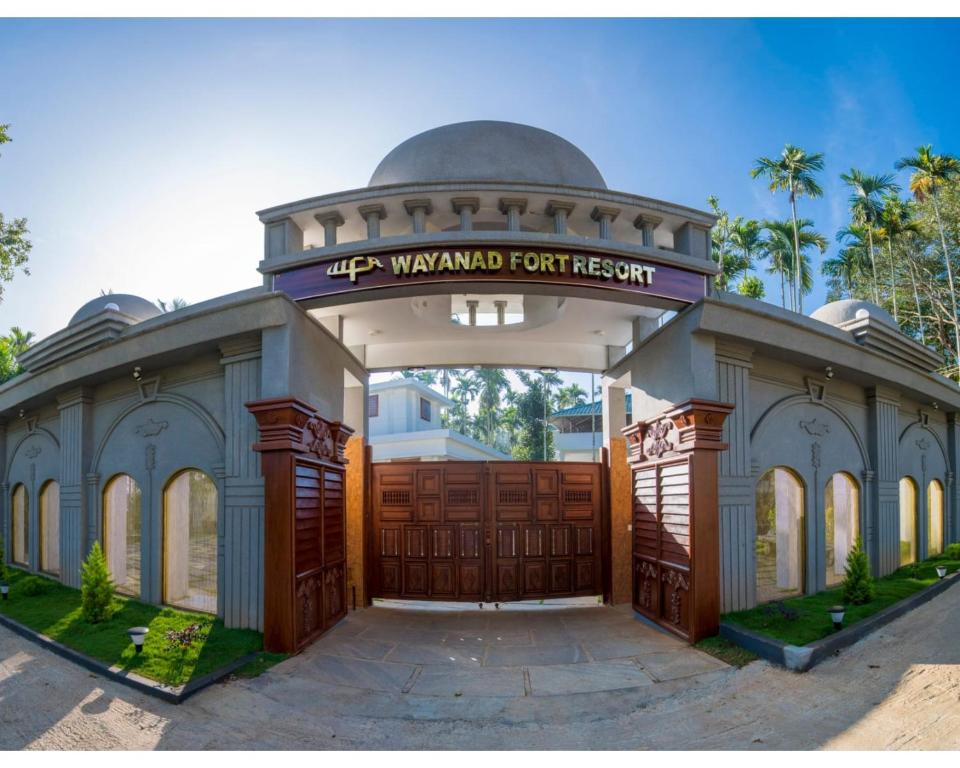 a garage with a sign on top of it at Wayanad Fort Resort, Noolpuzha, Kerala in Muthanga