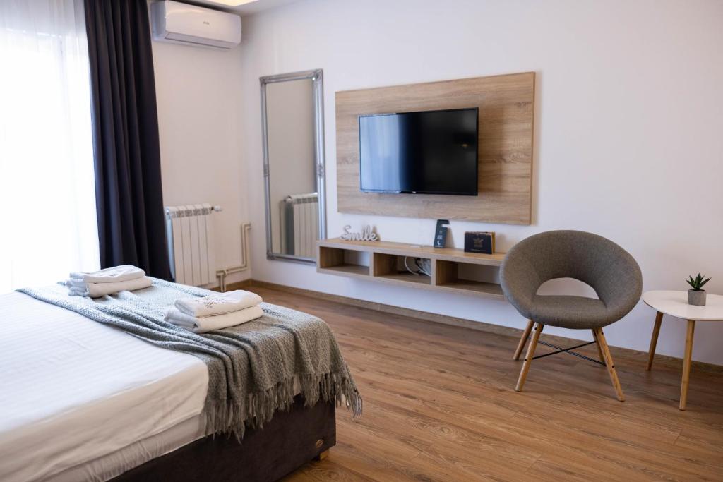 Postel nebo postele na pokoji v ubytování Marino Lux Prenoćište