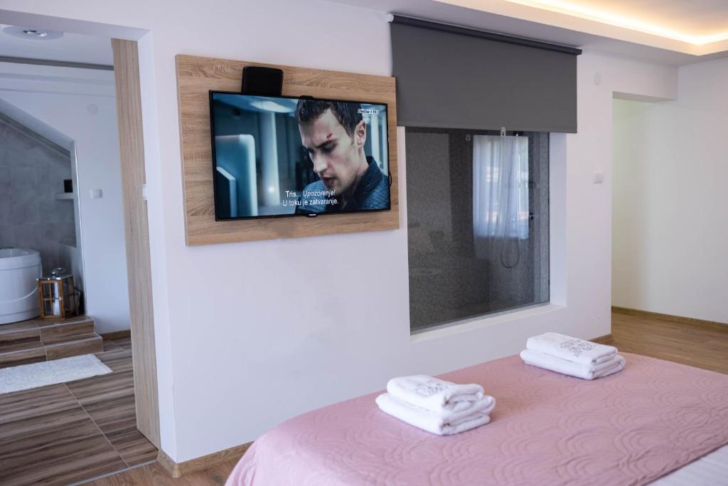 Postel nebo postele na pokoji v ubytování Marino Lux Prenoćište