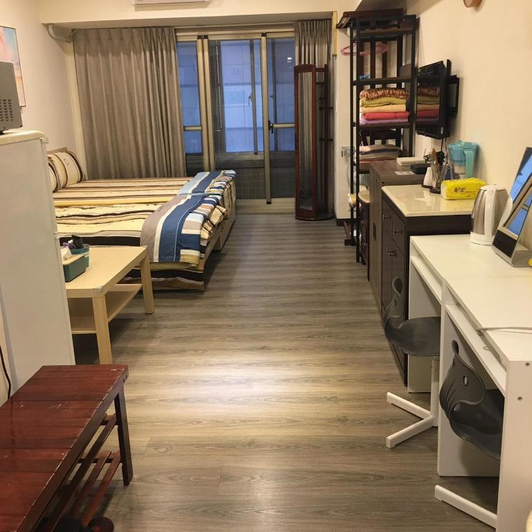 Postel nebo postele na pokoji v ubytování 果芒驛站旅店