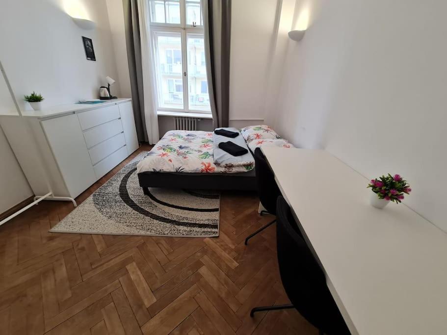 a small room with a bed and a window at Fantastic Apartments - OK11 Room - C in Warsaw