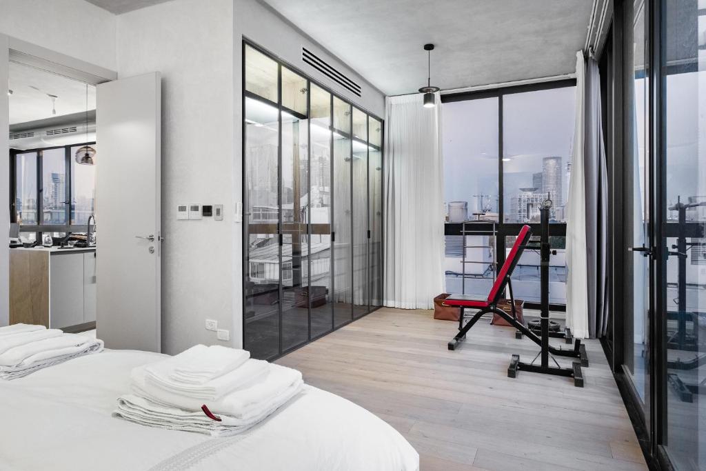 a bedroom with a bed and a view of the city at Top Tlv in Tel Aviv