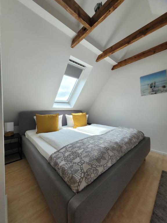 Postel nebo postele na pokoji v ubytování Ferienhaus Dünenweg