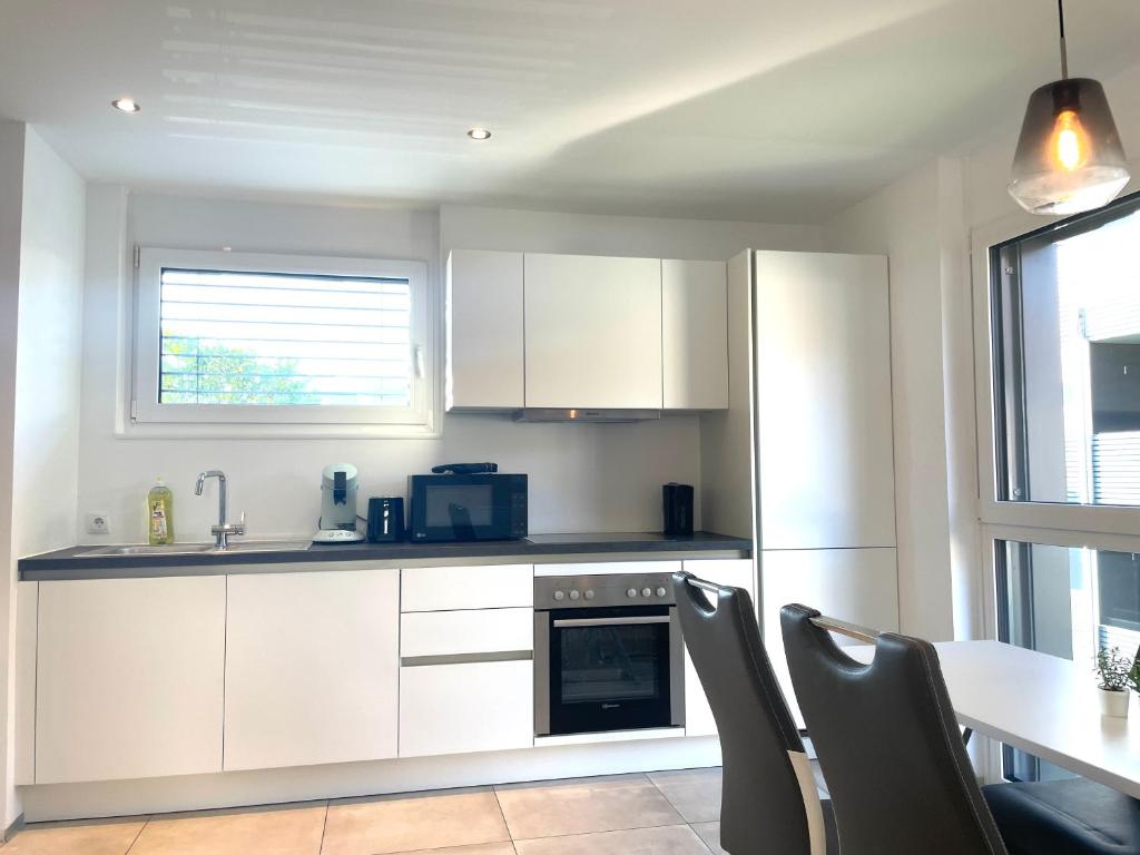 Kuchyň nebo kuchyňský kout v ubytování homy City Lodge in Feldkirch, Grenznähe und doch Zentral