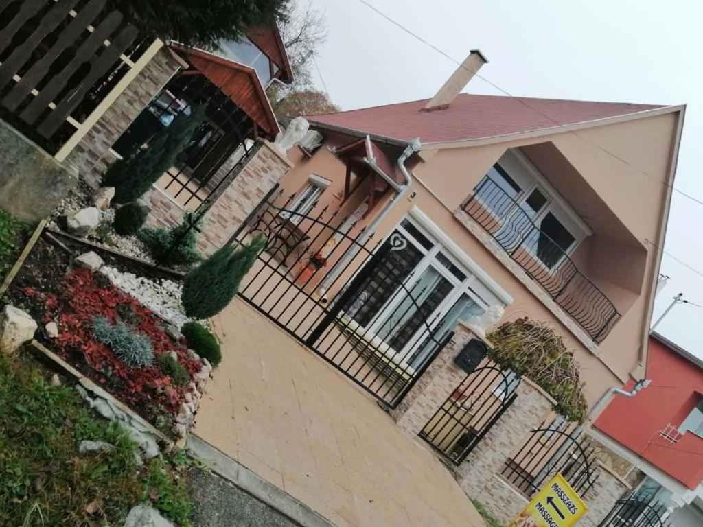 a large house with a fence and a driveway at Studio in Zalakaros/Thermalbad 20679 in Zalakaros