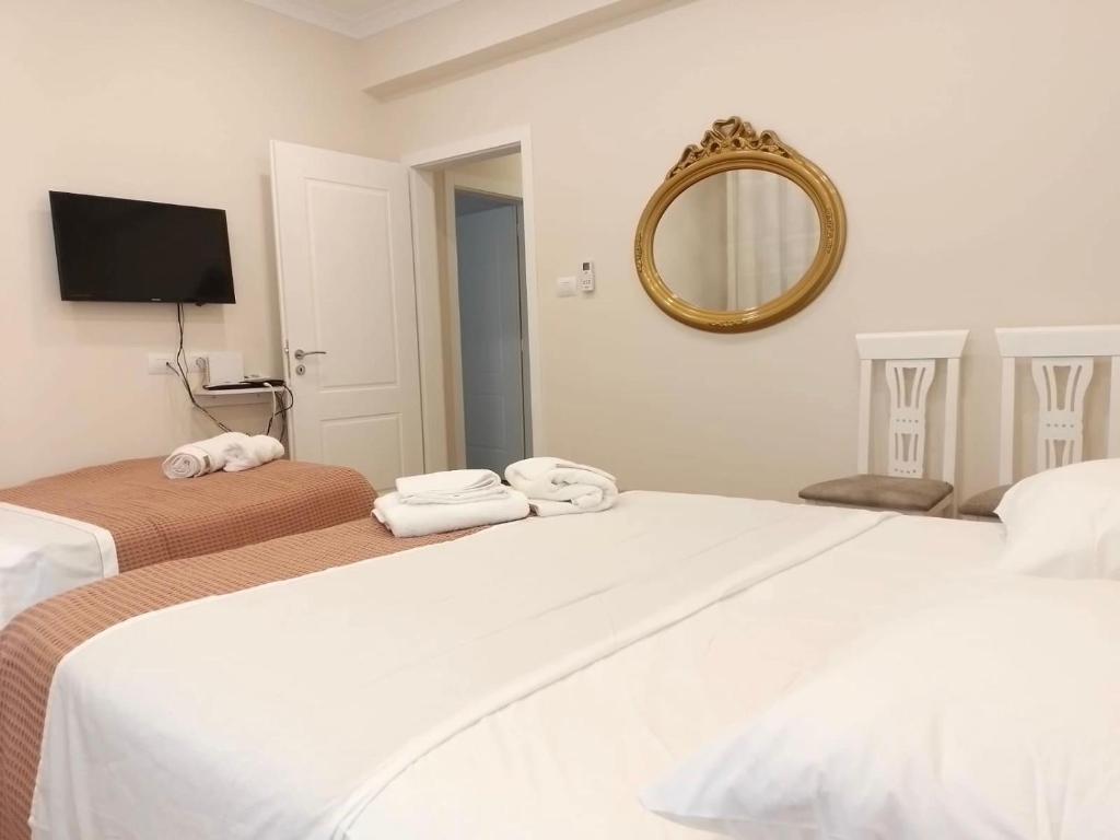 Postel nebo postele na pokoji v ubytování Serendipity Apartment