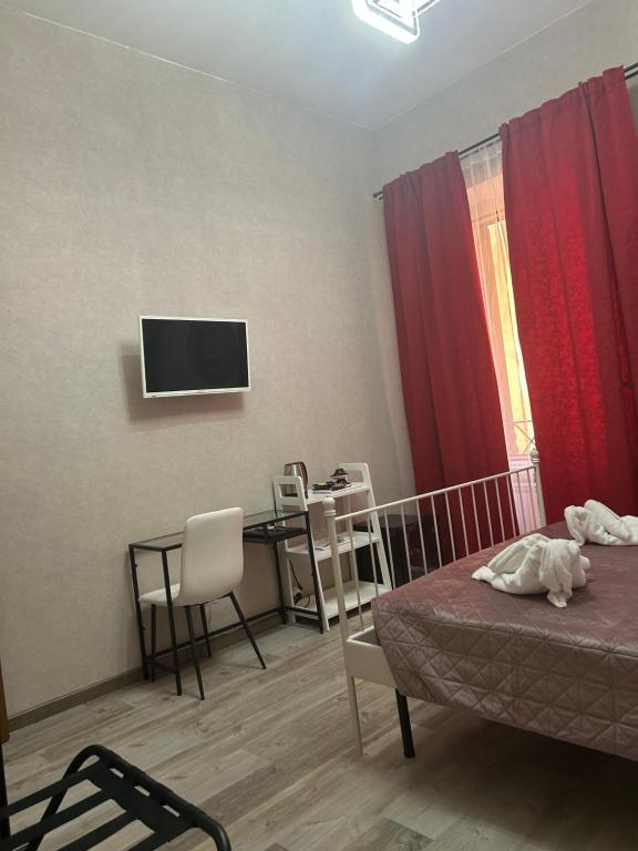 Telewizja i/lub zestaw kina domowego w obiekcie Vanella Rome Domus