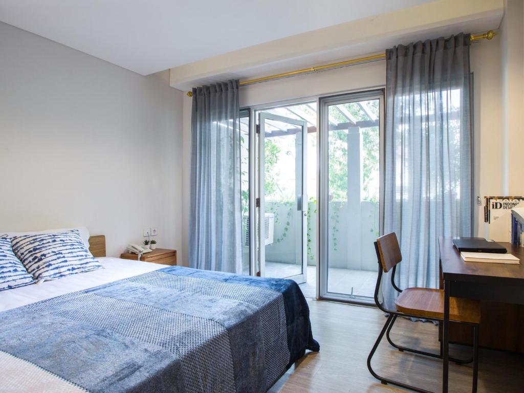 Säng eller sängar i ett rum på Cove Birah Senopati