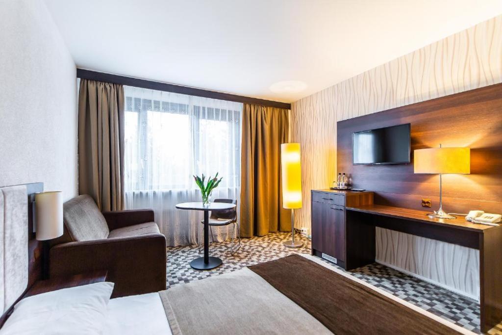 Postel nebo postele na pokoji v ubytování Hotel Solny