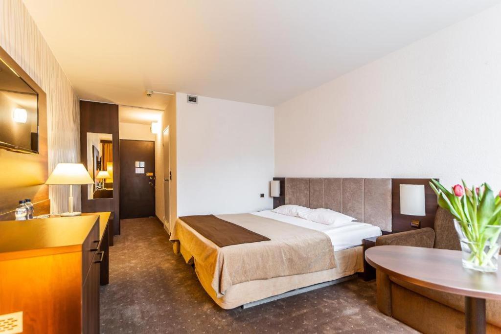 Postel nebo postele na pokoji v ubytování Hotel Solny