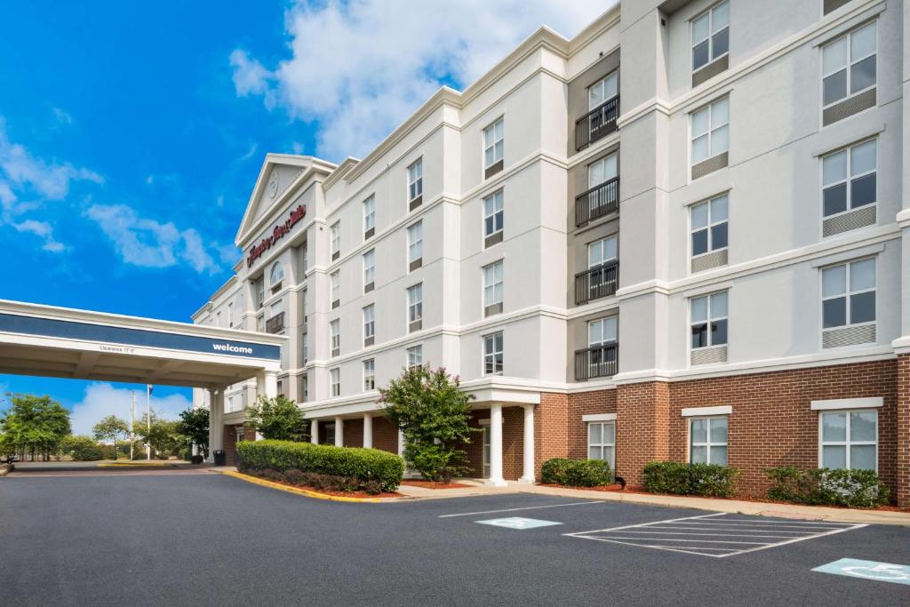 a rendering of the front of a hotel with a parking lot at Hampton Inn and Suites Fredericksburg in Fredericksburg
