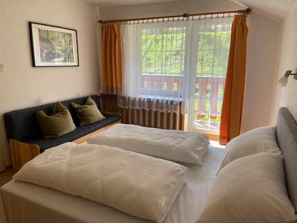 Postel nebo postele na pokoji v ubytování Hotel U STUDÁNKY