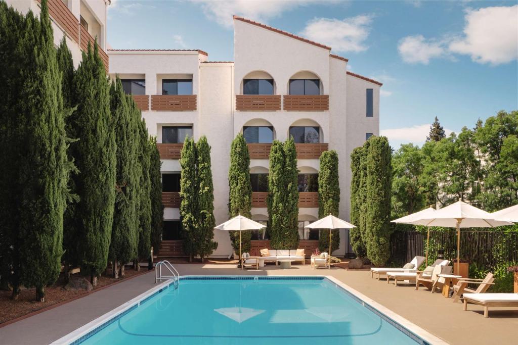 a hotel with a pool in front of a building at Avante, a JDV by Hyatt Hotel in Mountain View